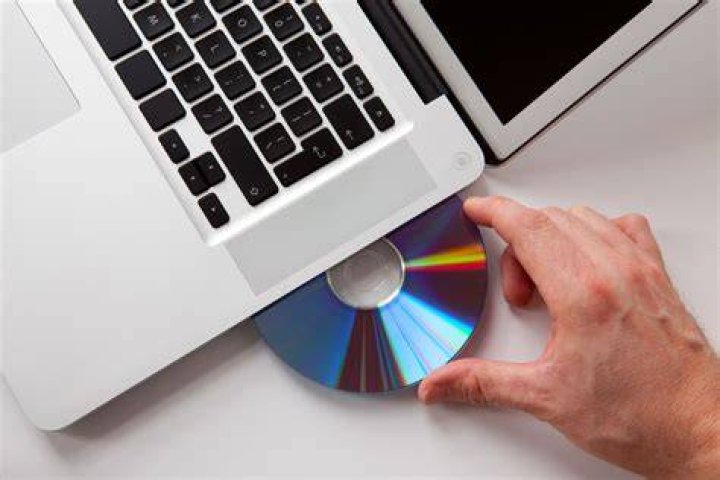 How do I insert a disc into my computer?