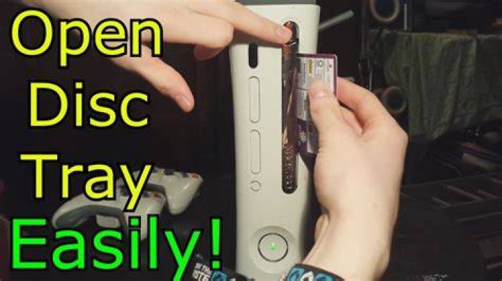 How do you open a stuck Xbox 360 disc tray?